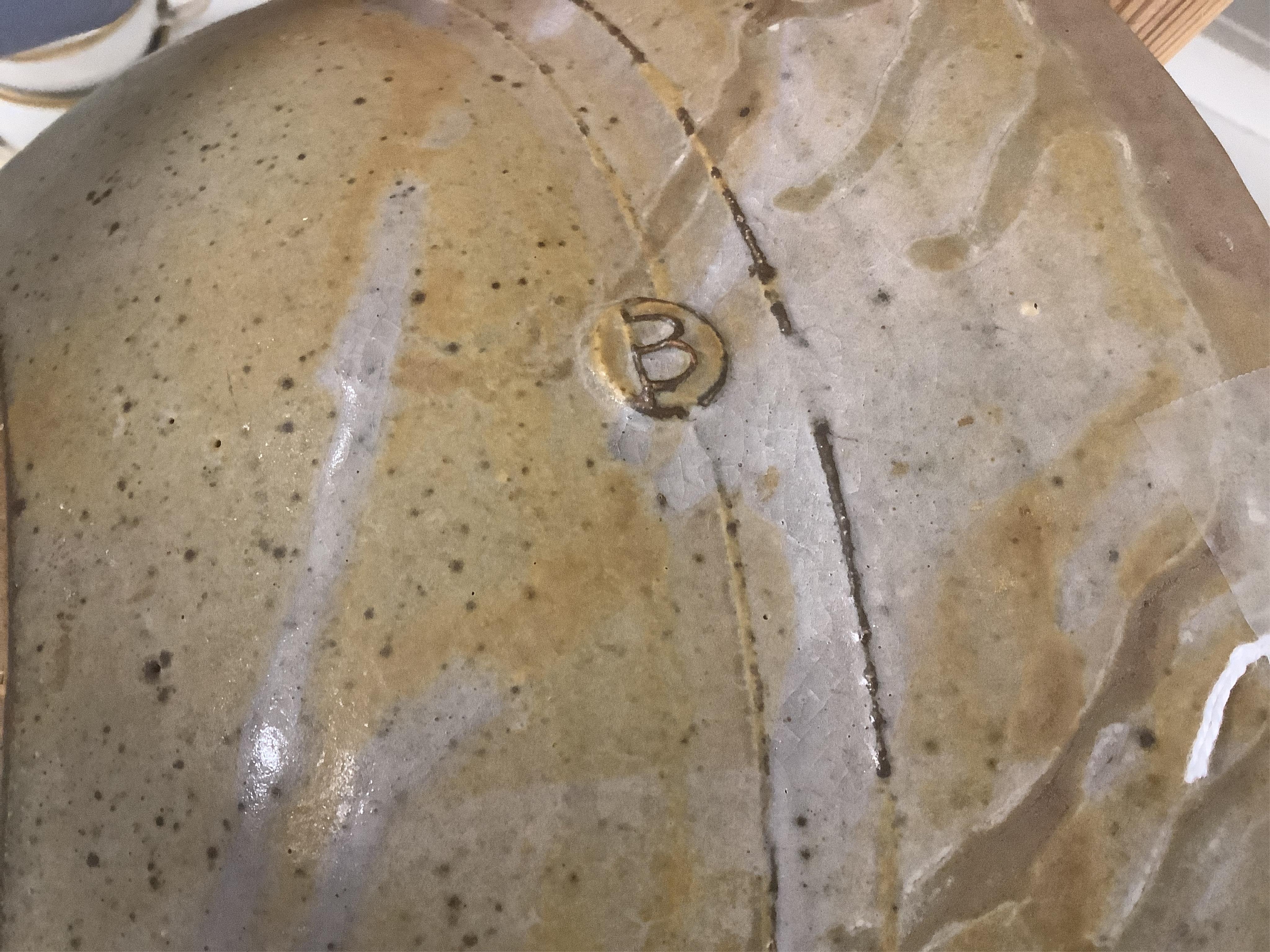 A large studio stoneware centre bowl with ‘B’ makers mark, 38cm in diameter. Condition - good